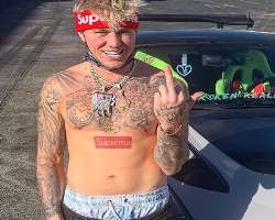 He is a tattoo freak and has various tattoos on his hands and chest.
